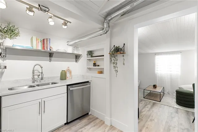 a view of a livingroom with furniture and a window