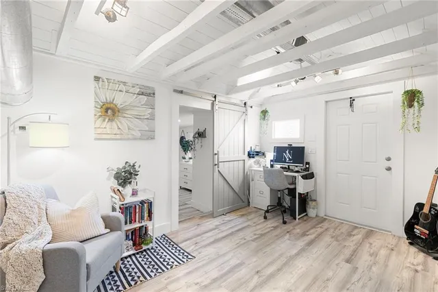 a view of a hallway view with wooden floor and staircase