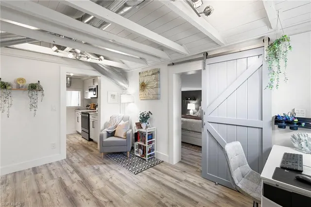 a bedroom with a bed and a lamp