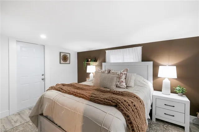 a bedroom with a bed and a couch