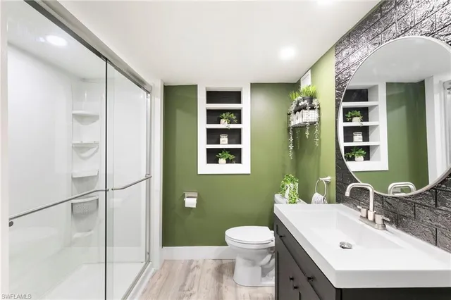 a bathroom with a shower and a sink
