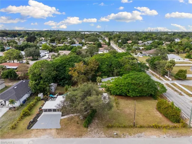 an aerial view of house with yard