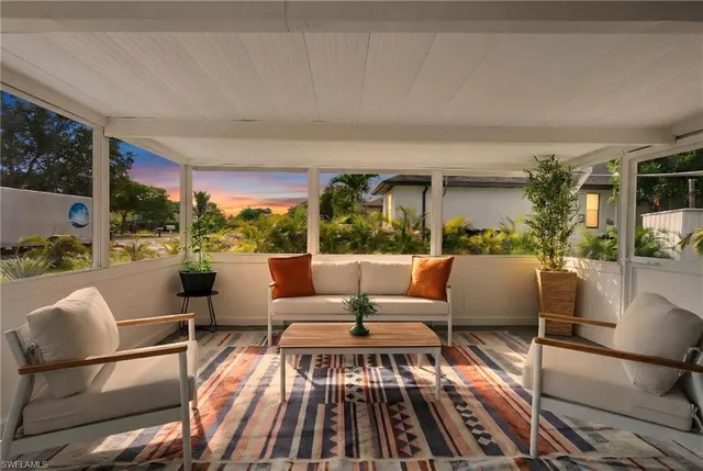 a outdoor living space with furniture and a potted plant