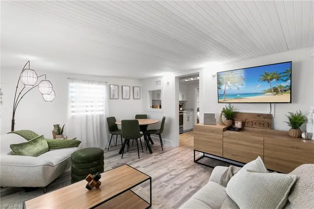 a view of a livingroom with furniture and wooden floor