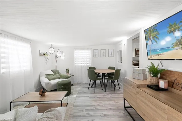 a living room with furniture and a table