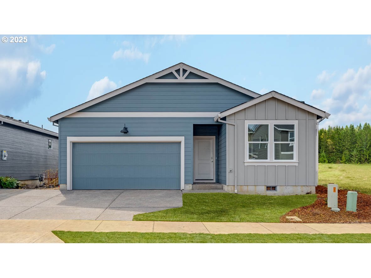 2905 V Street Springfield, OR 97477 - Photo 1 of 27 a front view of a house with a yard and garage