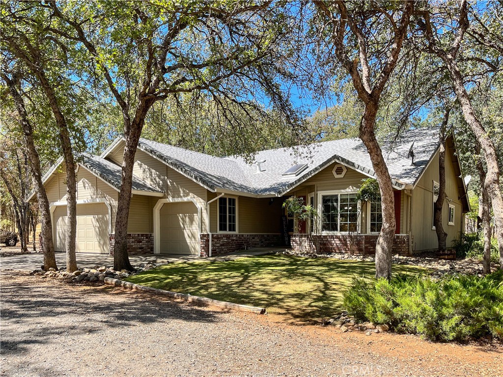 13170 Montecito Road Red Bluff, CA 96080 - Photo 1 of 1 a front view of a house with a yard