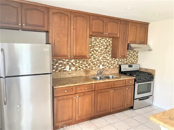 a white refrigerator freezer sitting inside of a kitchen