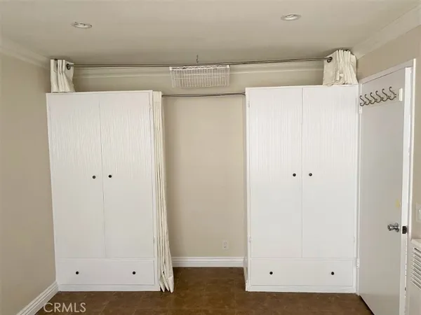 a view of storage and utility room with washer and dryer