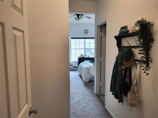 a bedroom with two beds and a window