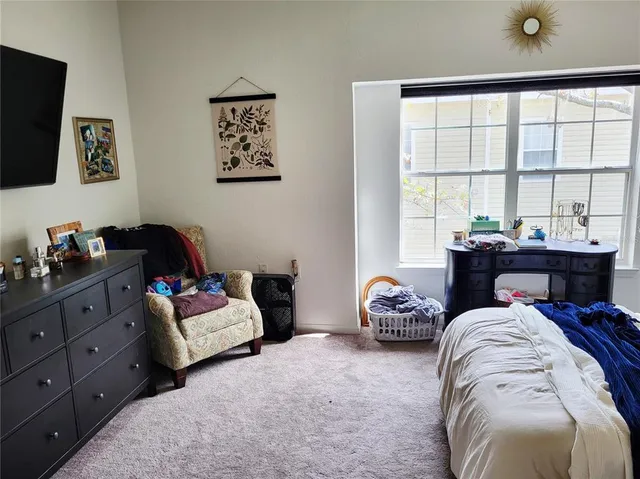 a bathroom with a toilet a sink and a mirror