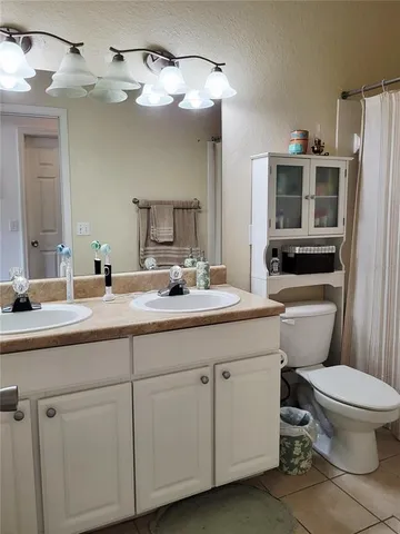 a bedroom with a bed and television