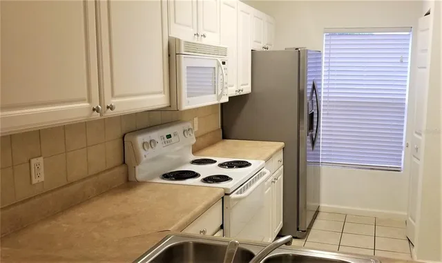 a bathroom with a sink and a washing machine