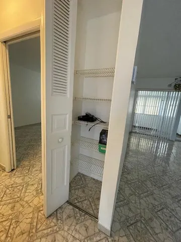 a bathroom with a sink and glass door
