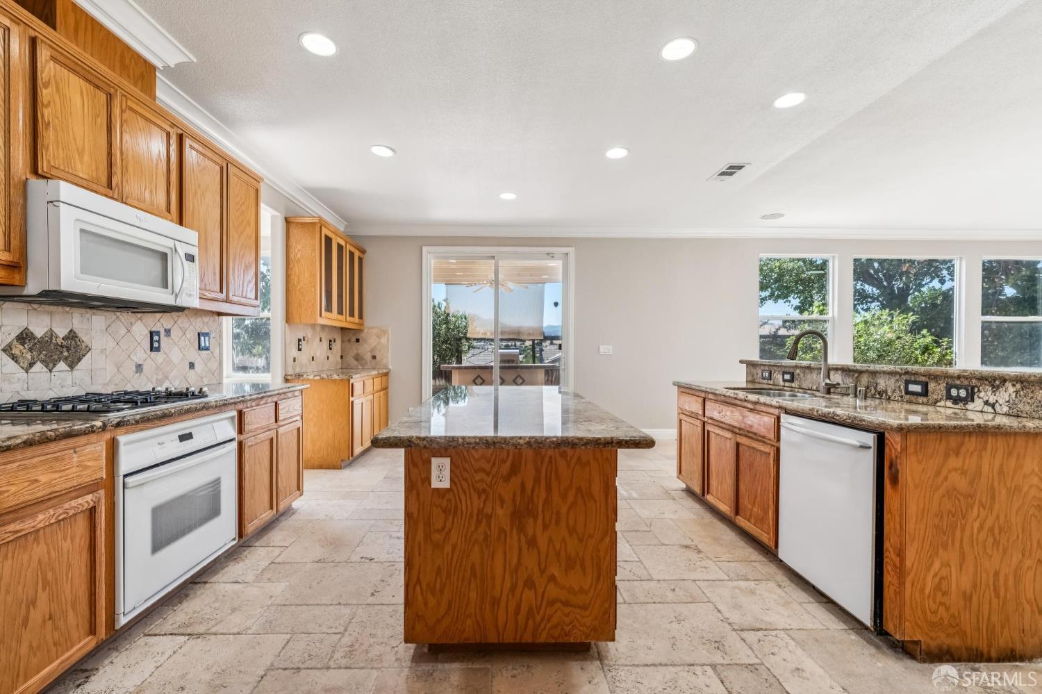 2344 Forty Niner Court Antioch, CA 94531 - Photo 16 of 94 a large kitchen with stainless steel appliances granite countertop a stove a sink dishwasher and a refrigerator