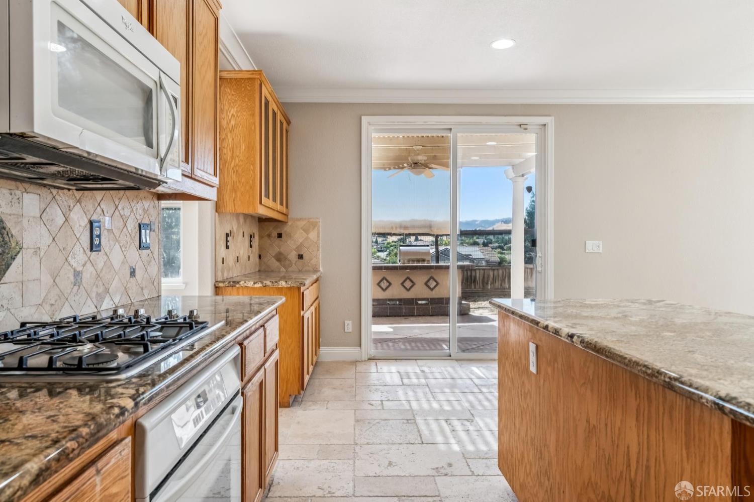 2344 Forty Niner Court Antioch, CA 94531 - Photo 17 of 94 a kitchen with stainless steel appliances granite countertop a stove a sink and a microwave