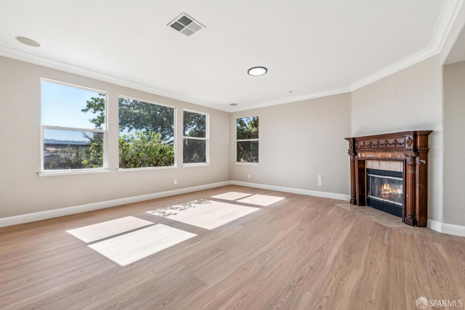 2344 Forty Niner Court Antioch, CA 94531 - Photo 22 of 94 a view of an empty room with a window and wooden floor