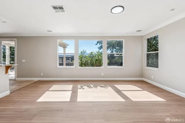 a view of an empty room with a chandelier