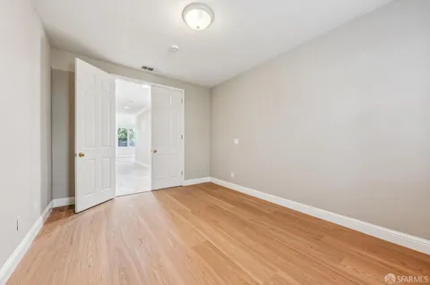 a spacious bathroom with a granite countertop tub double vanity and a mirror