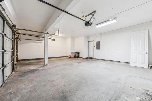 a view of a kitchen counter top with granite countertop a sink and a mirror