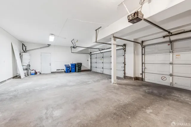 a spacious bathroom with a granite countertop sink and a mirror