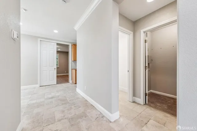 a view of a hallway with windows