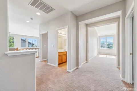 a bathroom with a sink a light fixture and a mirror