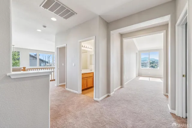 a bathroom with a sink a light fixture and a mirror