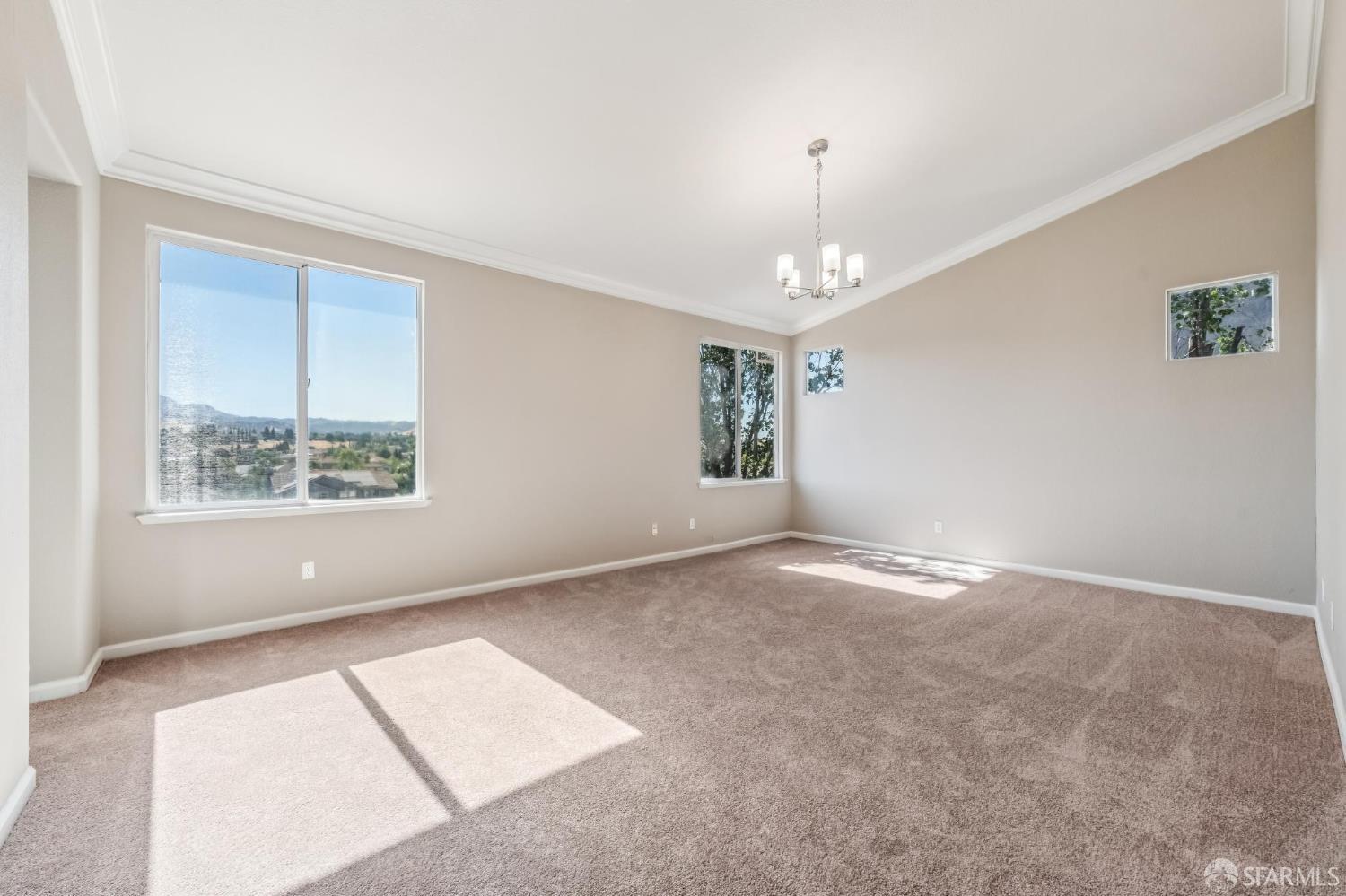 2344 Forty Niner Court Antioch, CA 94531 - Photo 46 of 94 an empty room with windows and chandelier