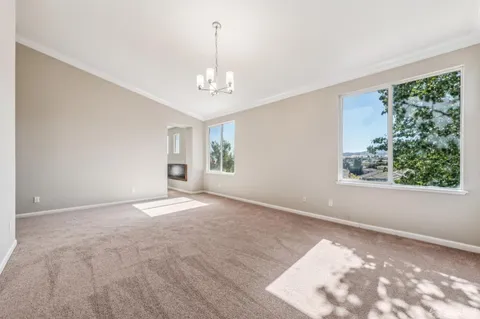 a view of a patio with table and chairs with wooden fence and plants