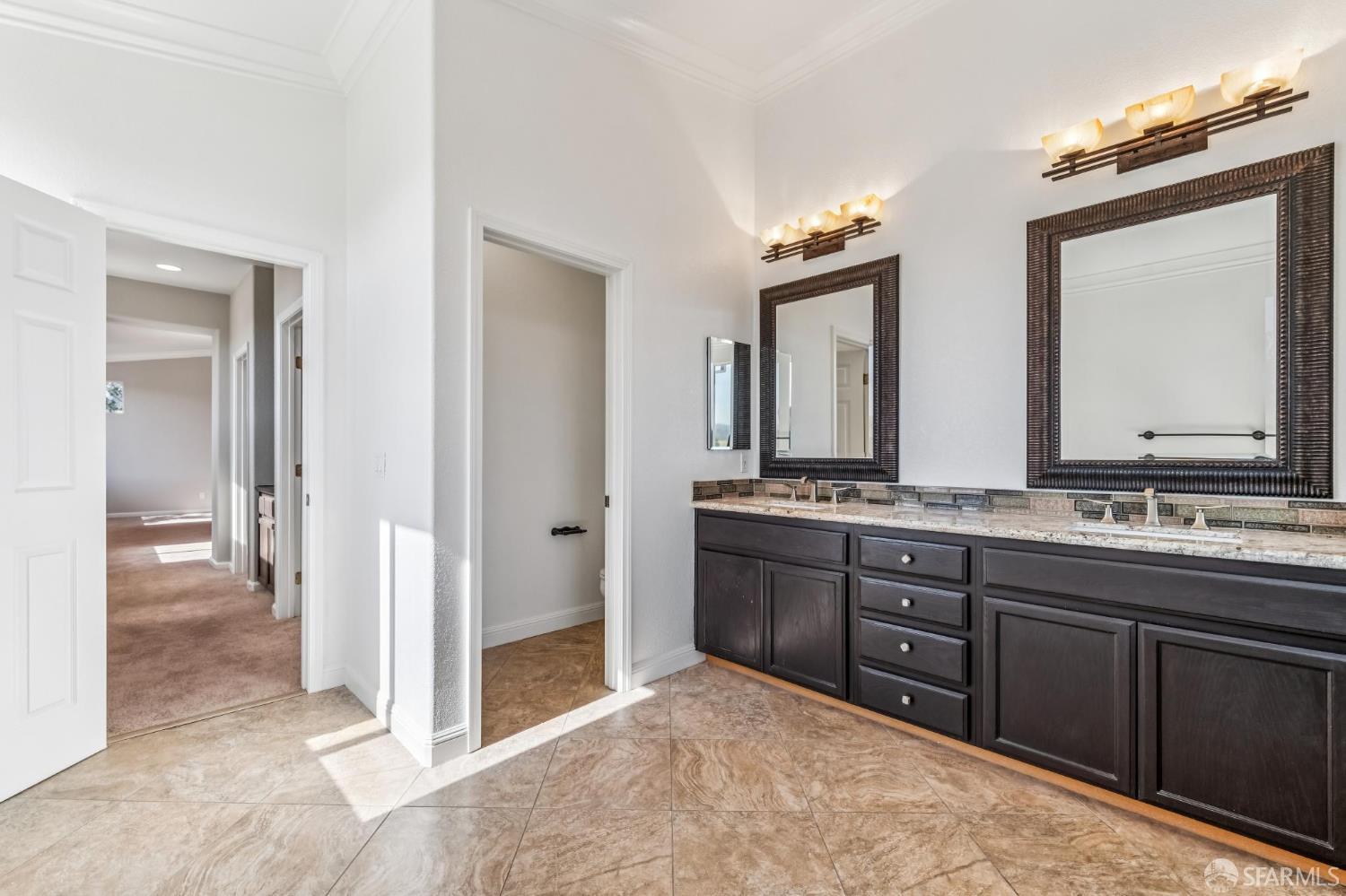 2344 Forty Niner Court Antioch, CA 94531 - Photo 59 of 94 a spacious bathroom with a granite countertop sink and a mirror