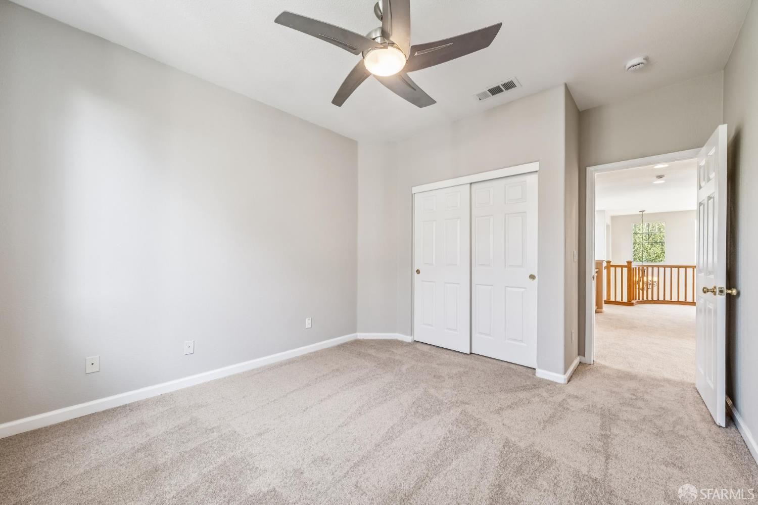 2344 Forty Niner Court Antioch, CA 94531 - Photo 67 of 94 an empty room with chandelier fan and windows