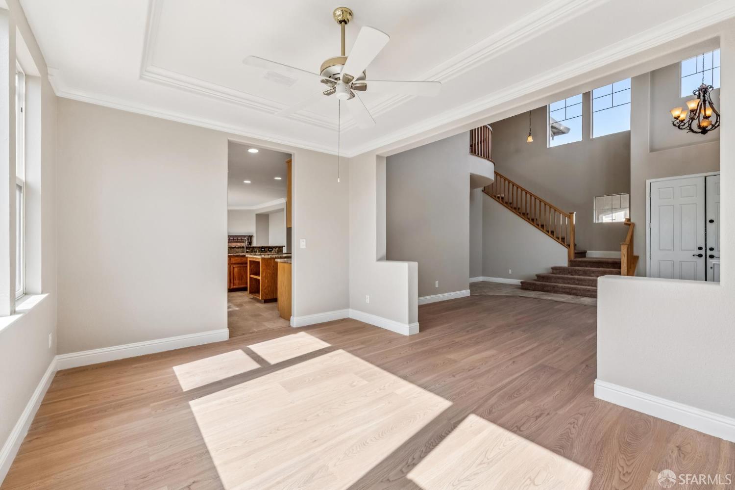 2344 Forty Niner Court Antioch, CA 94531 - Photo 10 of 94 a view of a livingroom with wooden floor and a ceiling fan