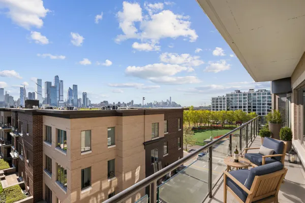 a view of a balcony with city view