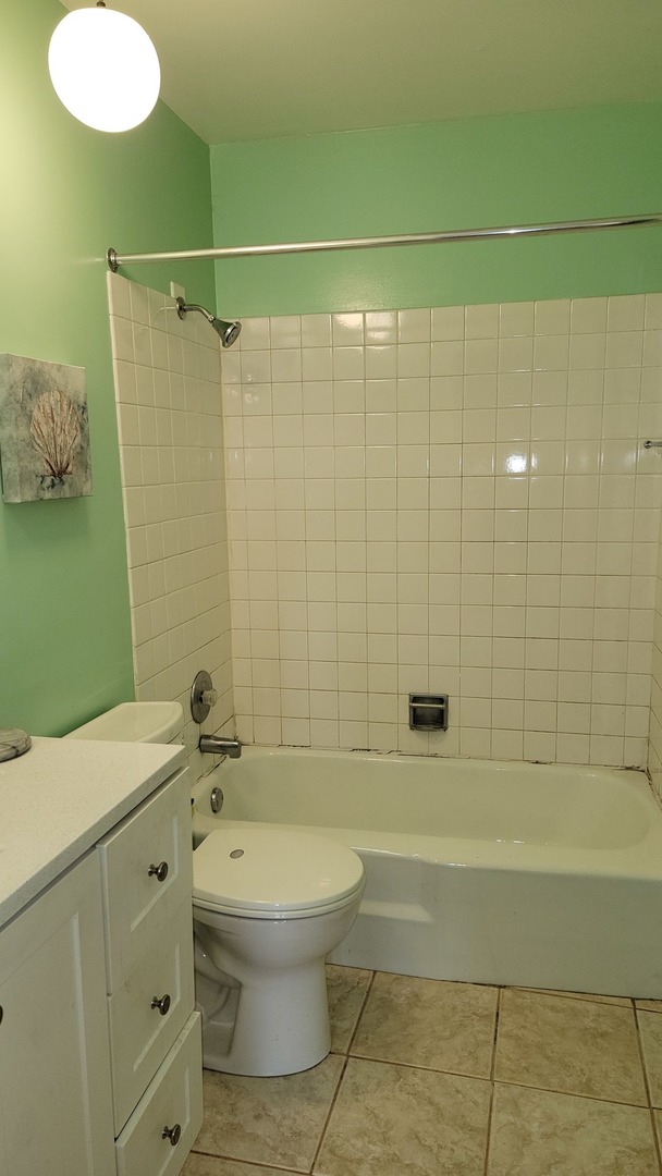 14621 Greenwood Road, Unit 408 Dolton, IL 60419 - Photo 18 of 25 a bathroom with a toilet sink and shower