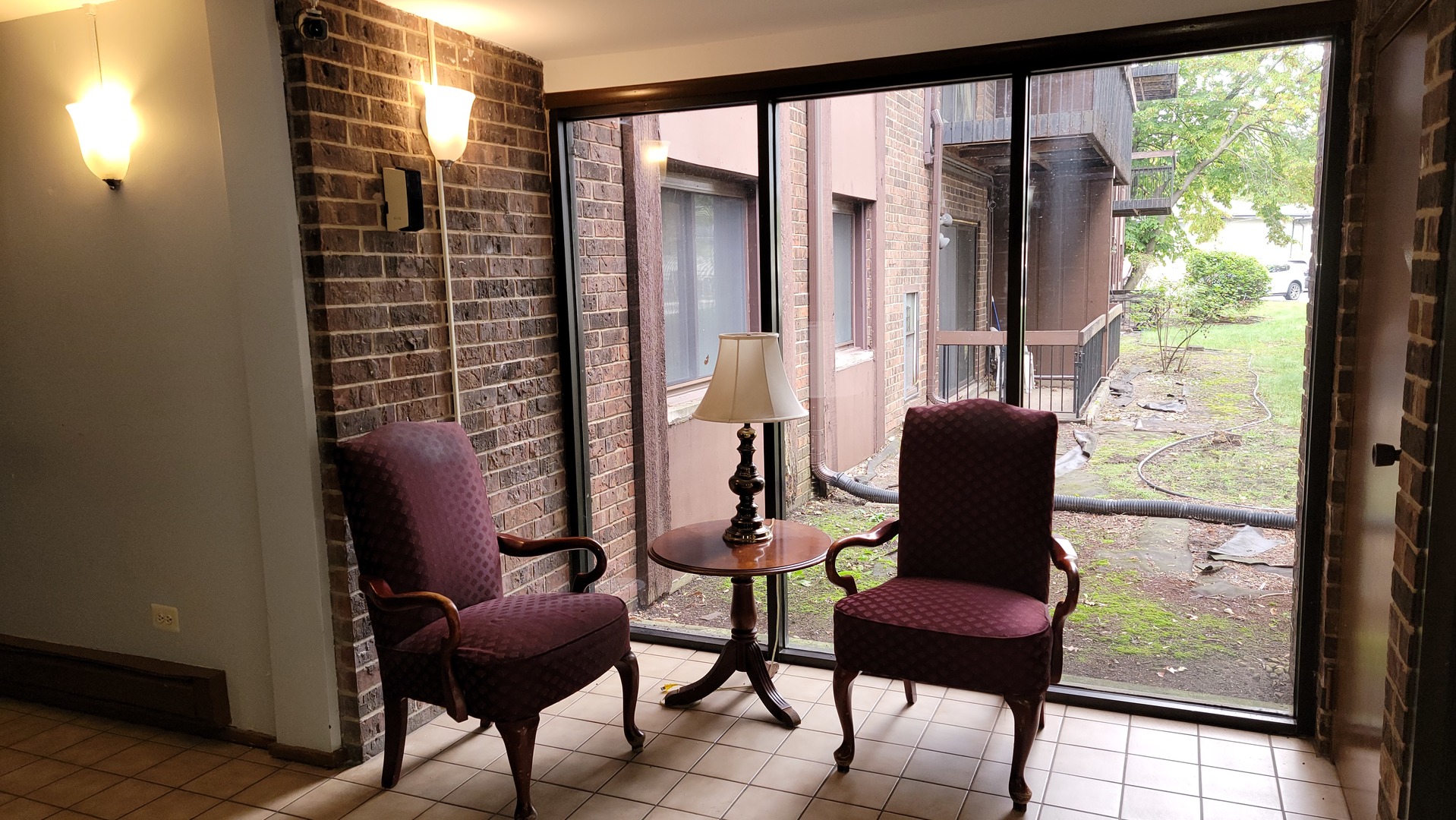 14621 Greenwood Road, Unit 408 Dolton, IL 60419 - Photo 3 of 25 a view of a room with furniture and a window