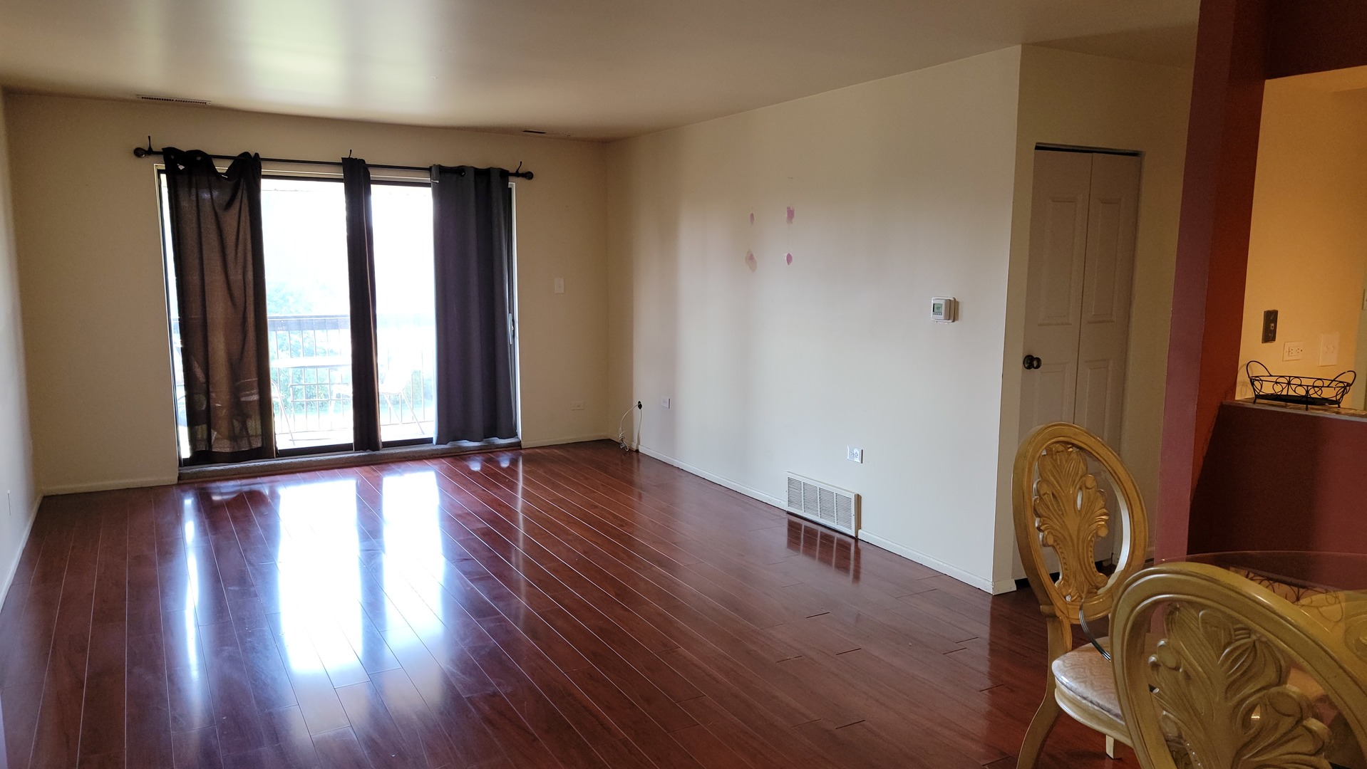 14621 Greenwood Road, Unit 408 Dolton, IL 60419 - Photo 5 of 25 an empty room with wooden floor and windows