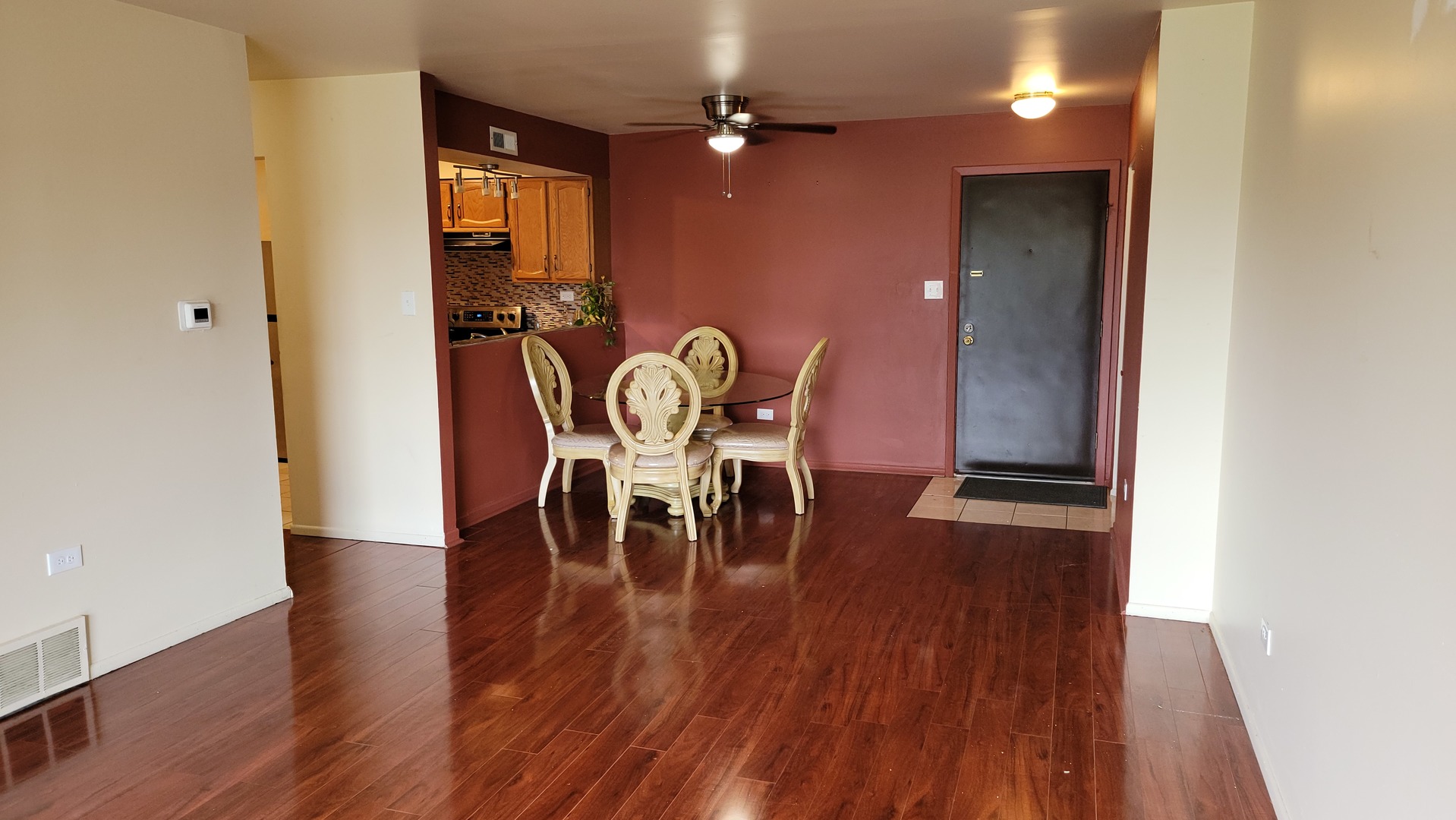 14621 Greenwood Road, Unit 408 Dolton, IL 60419 - Photo 6 of 25 a dining room with furniture and wooden floor
