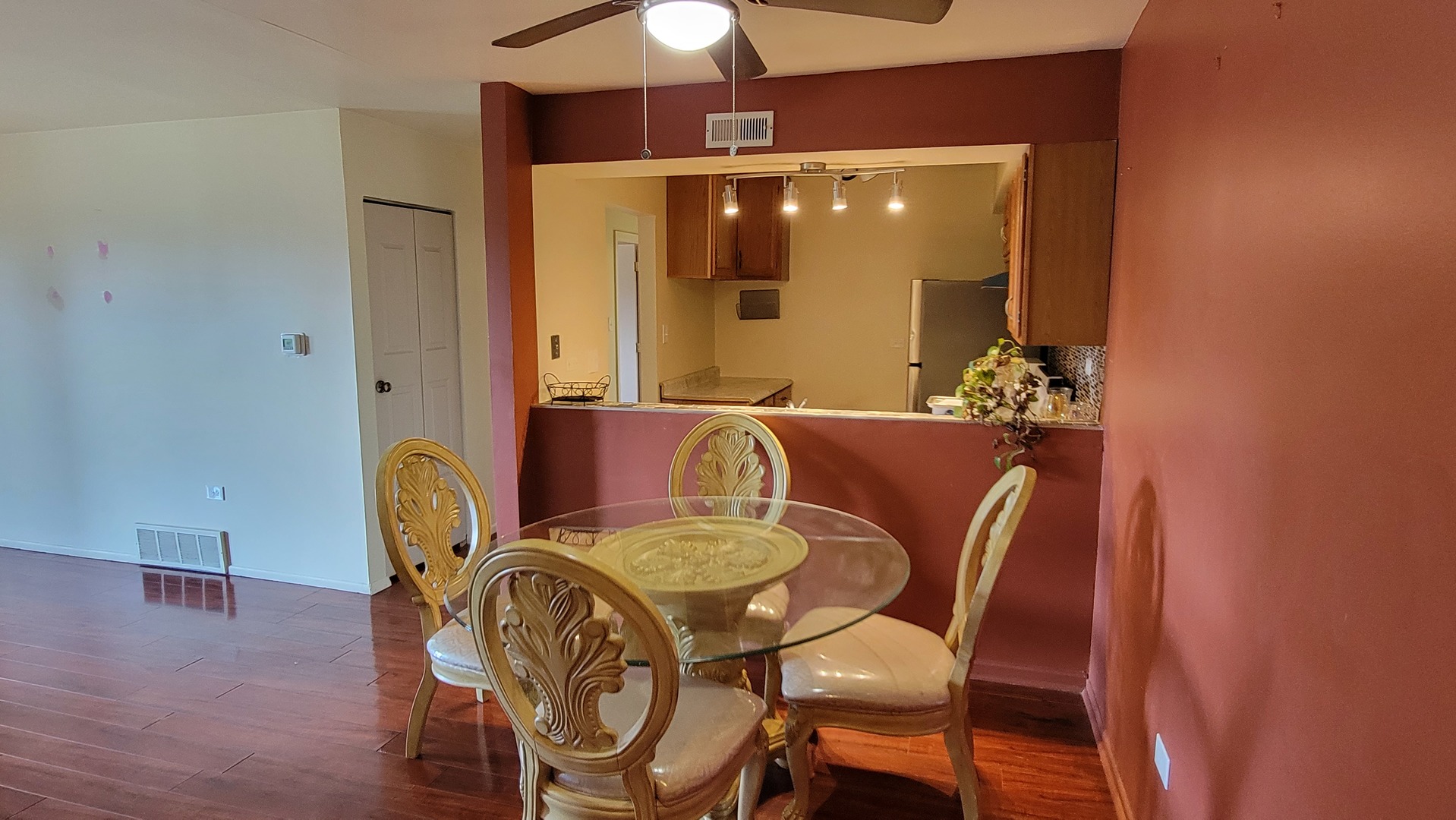 14621 Greenwood Road, Unit 408 Dolton, IL 60419 - Photo 7 of 25 a view of a dining room with furniture and wooden floor