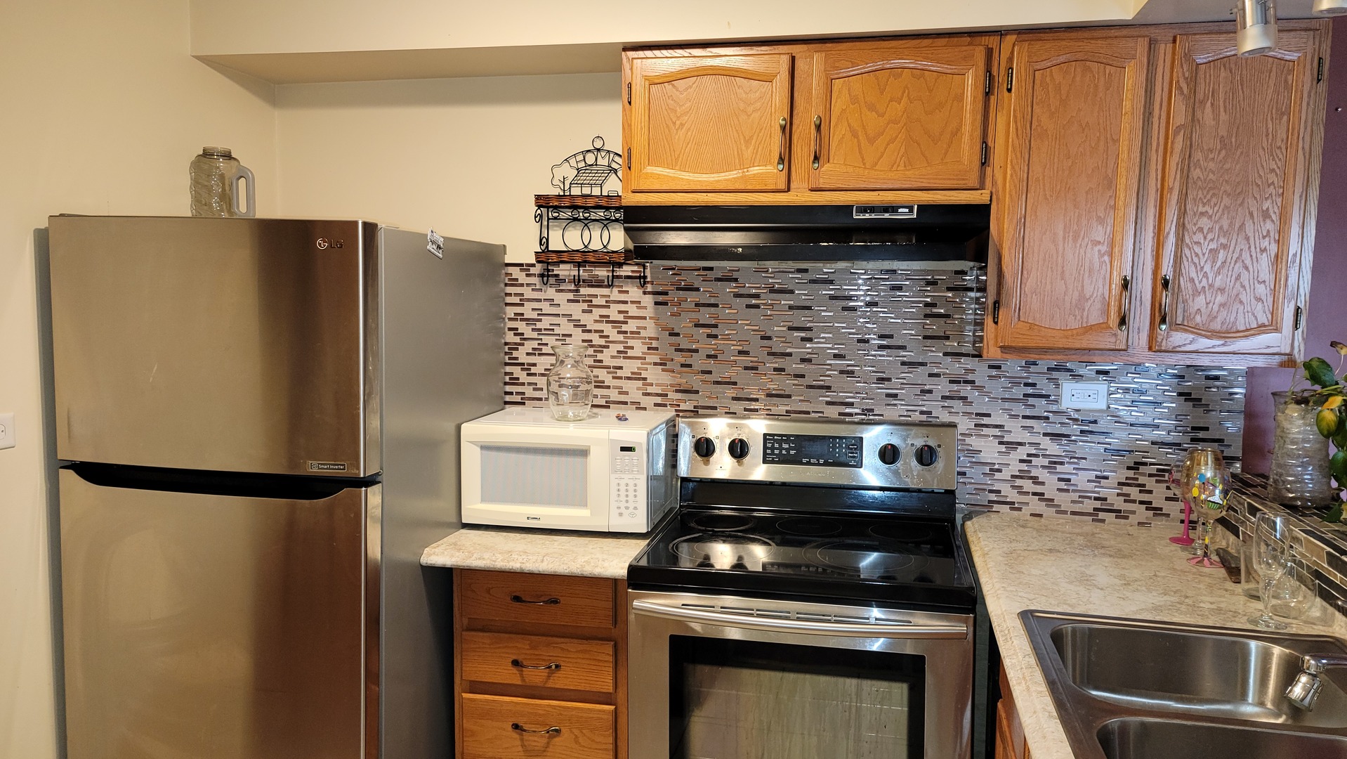 14621 Greenwood Road, Unit 408 Dolton, IL 60419 - Photo 8 of 25 a kitchen with granite countertop a refrigerator and a stove