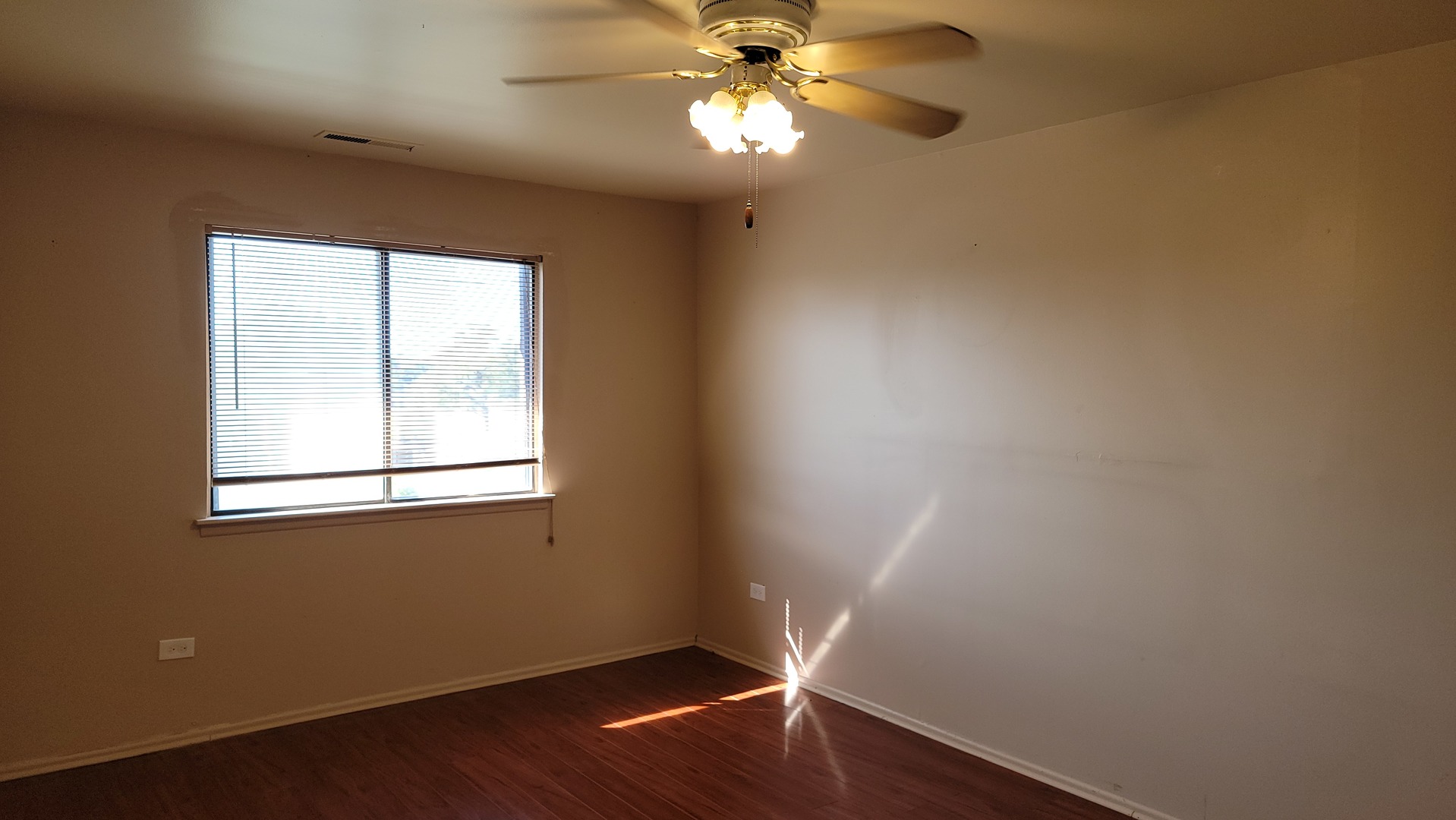 14621 Greenwood Road, Unit 408 Dolton, IL 60419 - Photo 10 of 25 wooden floor in an empty room with a window