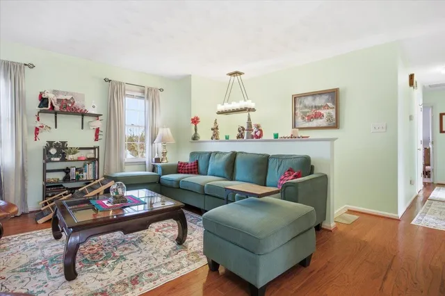 a view of dining room with furniture and wooden floor