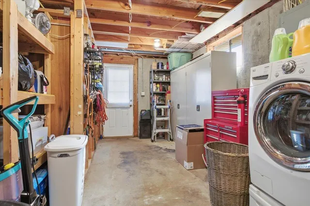 a view of a dirt road with a building in the background