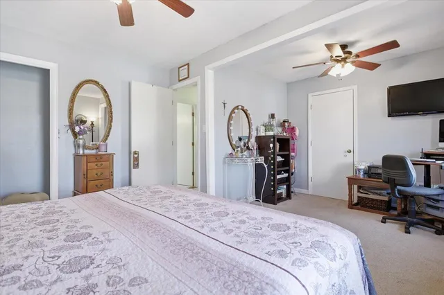 a view of residential houses with yard and swimming pool