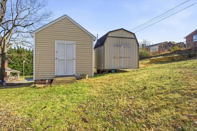 a view of a chairs and table in backyard