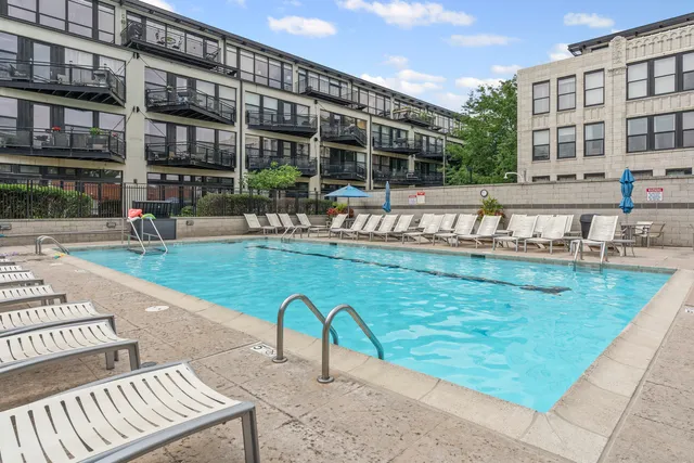 a view of a brick house with a yard