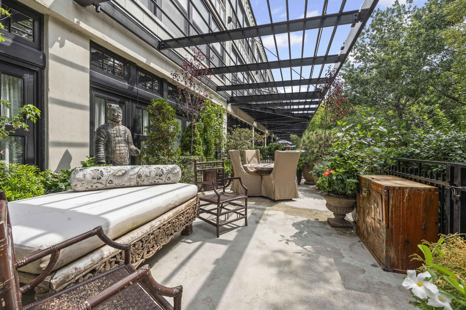1070 West 15th Street, Unit 147 Chicago, IL 60608 - Photo 2 of 17 a view of a backyard with sitting area and furniture