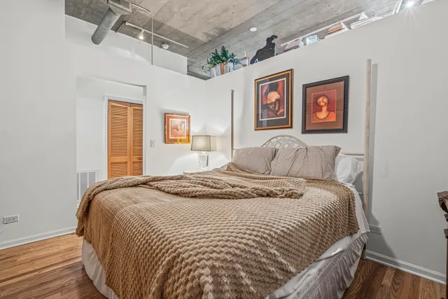 a bedroom with bed and window