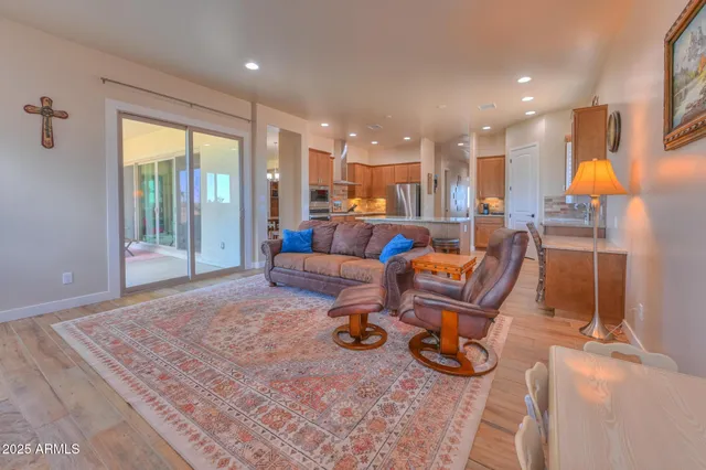 a living room with furniture fireplace and flat screen tv