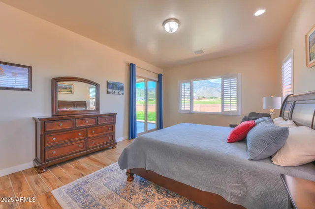 a bedroom with a bed and a dresser